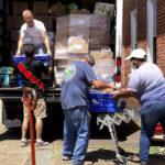 Volunteers loading donated food for the homeless and needy for Helping The Homeless Ministry